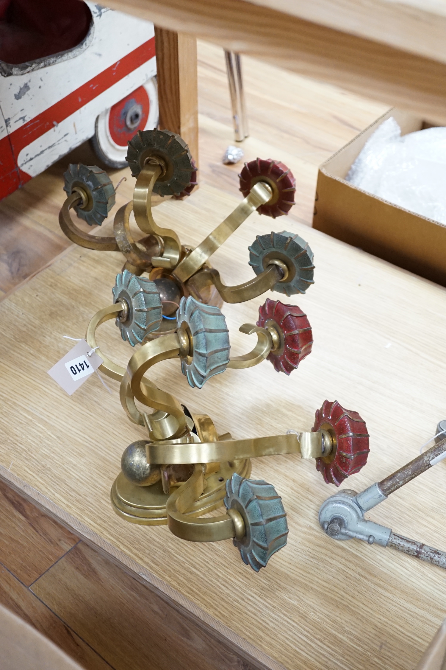 A pair of brass five branch wall lights